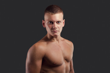 Fototapeta premium Healthy muscular young man. Sport portrait. Fitness body.