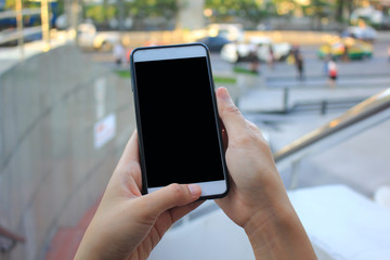 woman hand holding smartphone with blank screen