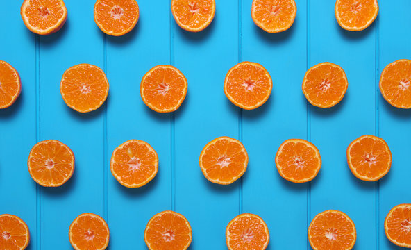 Tangerine on wood table.