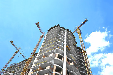 Crane and highrise construction site