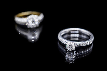 Close up Jewelry diamond ring on black background with reflection