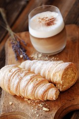 Delicious vanilla cream cakes and lavender coffee