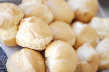 Delicious cakes with vanilla cream and sugar