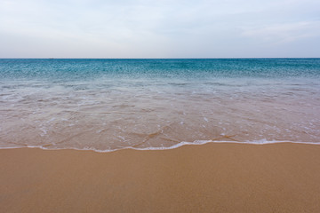 Fototapeta na wymiar Sand beach with wave and sea with sky. Background