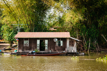 Fototapeta na wymiar Traditional vinatge local floating house or raft house in river, Uthaithani, Thailand