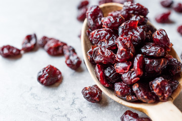Dried Blueberries in Wooden Spoon.