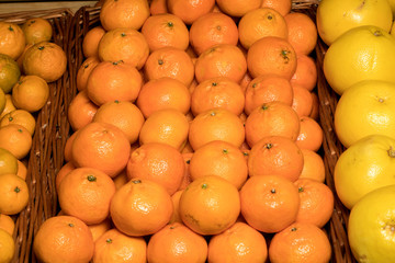 Bunch of fresh mandarin oranges on market.