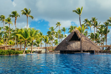 Tropical swimming pool in luxury resort, Punta Cana - obrazy, fototapety, plakaty