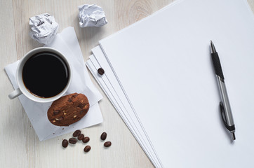 Coffee with cookies and paper