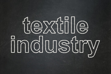 Manufacuring concept: text Textile Industry on Black chalkboard background