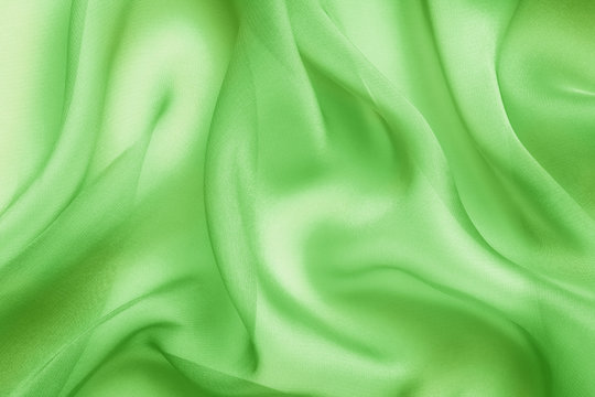green fabric with large folds abstract  background