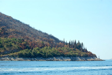 Lighthouse on the slope of one of the mountains of the Bay of Kotor.