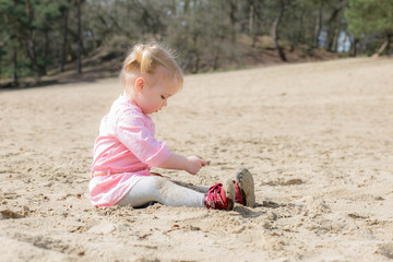 Child playful with sand in nature, happy lifestyle