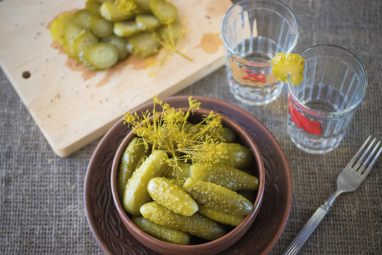 Pickled cucumbers and glasses with vodka. The concept of the Soviet Union