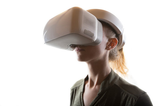 Woman wearing virtual reality 3D headset and exploring the play