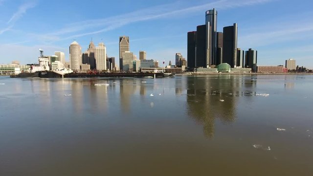 Over Icy River and Barge Towards Downtown Detroit Skyline
