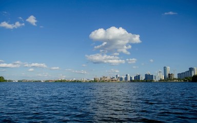 Obraz premium landscape of blue water against the background of a modern city. Minsk, Belarus .