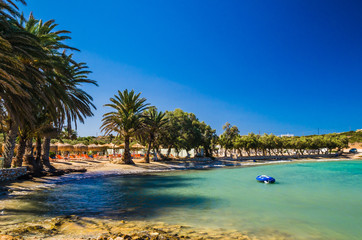 Agia Irini beach, Paros island, Greece. Beautiful greek beach with palms in Cyclades Islands