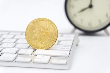 Golden Bitcoins on keyboard. Selective focus.