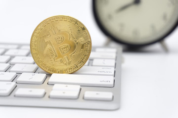 Golden Bitcoins on keyboard. Selective focus.