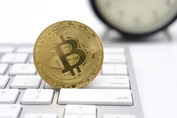 Golden Bitcoins on keyboard. Selective focus.