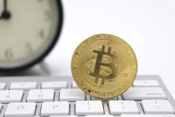 Golden Bitcoins on keyboard. Selective focus.