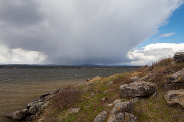 Lake. Tavatuy. Rocky shore. The wind on the lake. Storm cloud