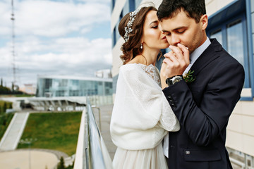 wedding photoshoot beautiful couple bride and groom long veil and white dress on mountains background lake Como Italy ceremony luxury beautiful sunny day