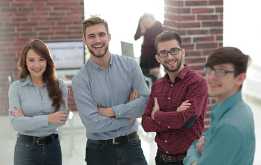 Happy smiling business team in office.