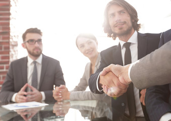 background image of handshake of business partners