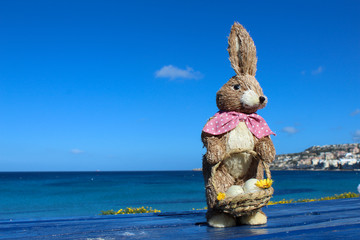female easter bunny holding basket with eggs