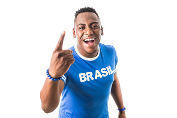 Brazilian man fan celebrating on footbal match on white background. Brazil colors.