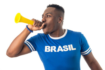 Brazilian man fan celebrating on footbal match on white background. Brazil colors.