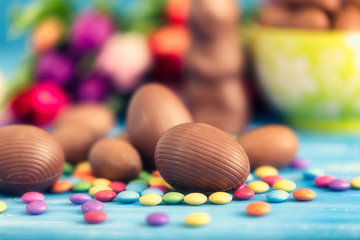 Fototapeta na wymiar chocolate easter eggs and tulips