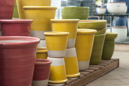 closeup of colorful ceramic pots in a gardening store
