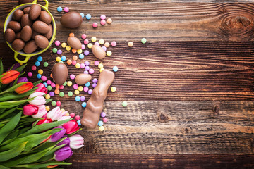 chocolate rabbit, easter eggs and tulips