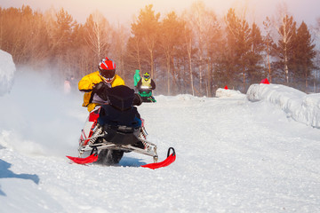 Snowmobile. Snowmobile races in snow. Concept winter sports, racers.