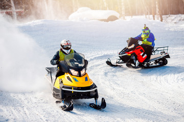 Fototapeta na wymiar Snowmobile. Snowmobile races in the snow. Concept winter sports, racers.