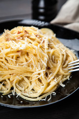 Spaghetti carbonara with egg and pancetta