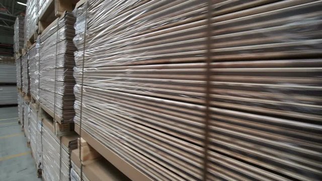 Industrial equipment for the production of laminate. Furniture factory production line. Laminated flooring.The factory for the production of laminate.