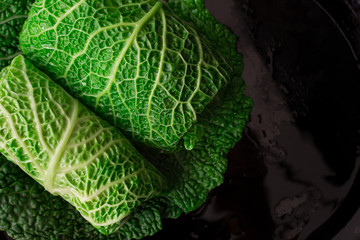 Fototapeta premium stuffed cabbage. on a black plate