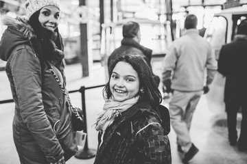 .Young family spending the day together doing activities for madrid. The three sisters together, laughing during their day of walking. Lifestyle