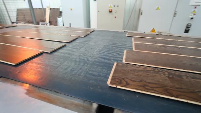 Industrial equipment for the production of laminate. Furniture factory production line. Laminated flooring.The factory for the production of laminate.