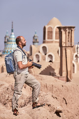 Solo traveler walks through the ancient town of Kashan , Iran.