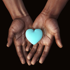 Fototapeta premium African hands holding a blue heart