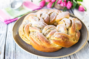 Sweet braided easter bread with marzipan and pistachio