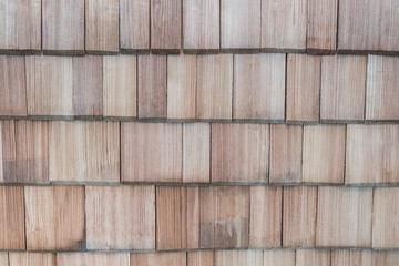 Wooden shingles on roof background traditional wooden roof of larch, Roof made of solid wood background