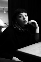 Beautiful and fashionable girl in a restaurant at a business meeting