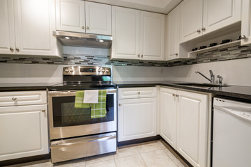 Modern kitchen interior with stainless steel appliances.