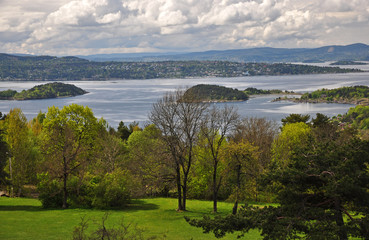 Norwegian Oslofjord in the spring with mountains on the horizon.